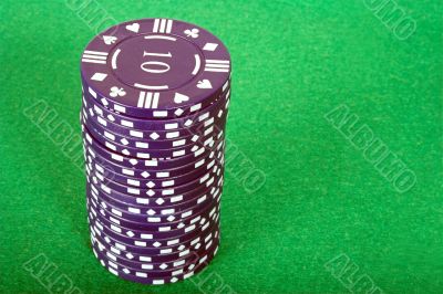 blue pile of casino chips over green