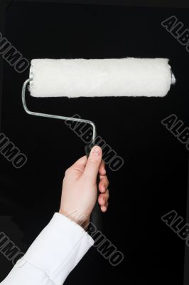 hand holding a roller