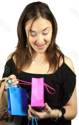 girl looking at present inside - gift bags
