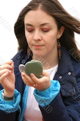 applying purple makeup