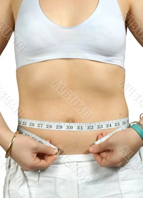 woman mesauring her waist