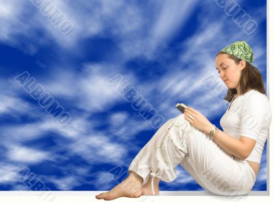 girl reading a book - sky background