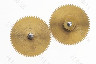 two old gold-coloured little cogwheels