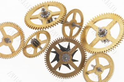 seven old gold-coloured little cogwheels