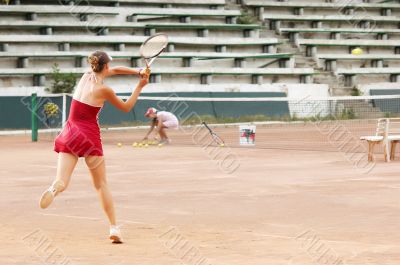 blond girl playing tennis