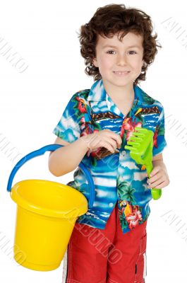 adorable boy playing in the beach