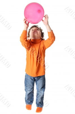 adorable boy playing with balloon