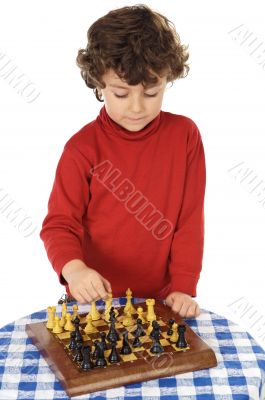 Adorable boy playing the chess