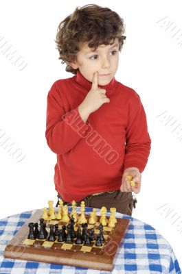 Adorable boy playing the chess
