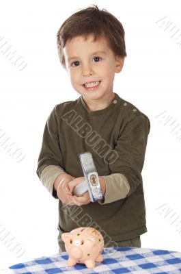 adorable boy breaking the money box