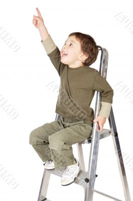 adorable boy ndicating the sky