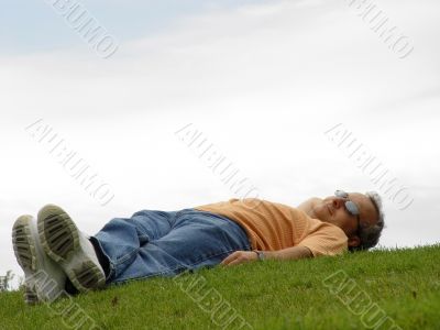 A man lying on the grass