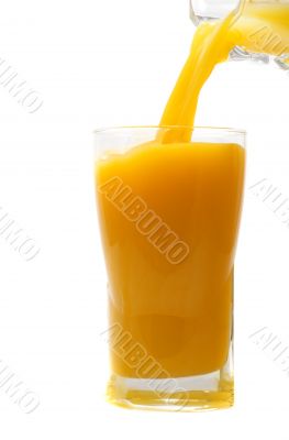 pouring fresh orange juice