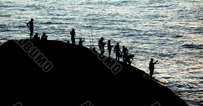 Anglers at sunset