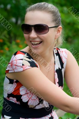 The young laughing girl on the nature