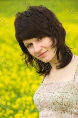 Young woman in yellow flowers