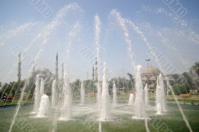 Blue Mosque through fountains