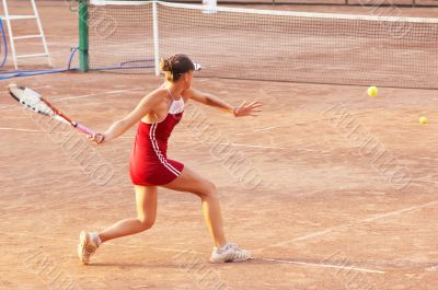 blond girl playing tennis