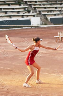 blond girl playing tennis
