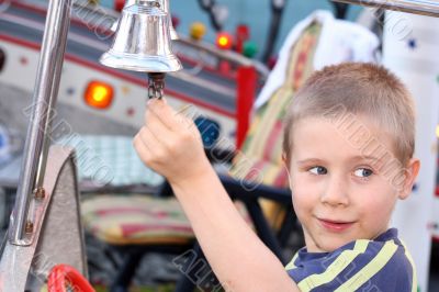 child with bell