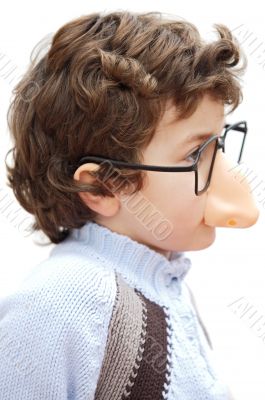 adorable boy with glasses and nose of toy