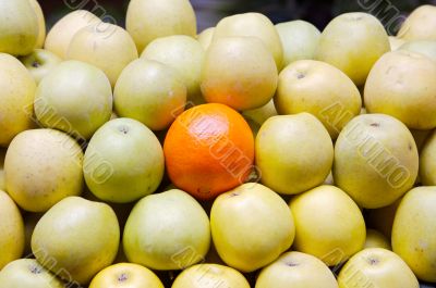accumulated apples whit a orange