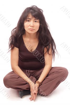 Asian girl sittng cross-legged
