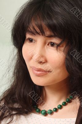 Asian girl in malachite beads