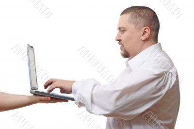 Man typing on notebook