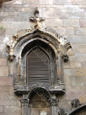 Ancient window of a cathedral . Barcelona