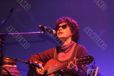 Playing guitar and singing