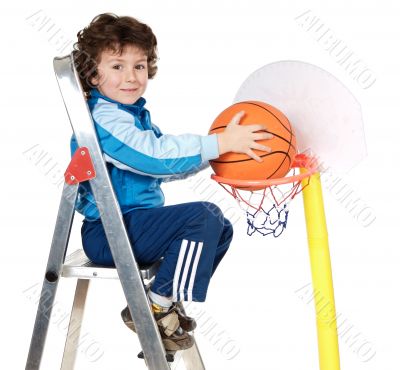 adorable child playing the basketball