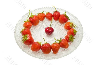Strawberries and cherry on dish, isolated on white