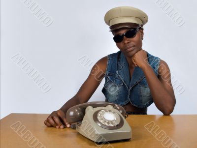 African girl with old phone