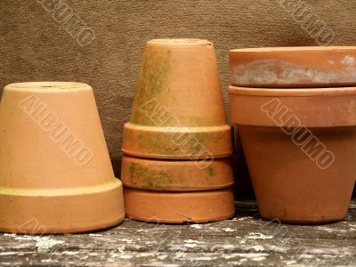 row of stacked terra cotta pots