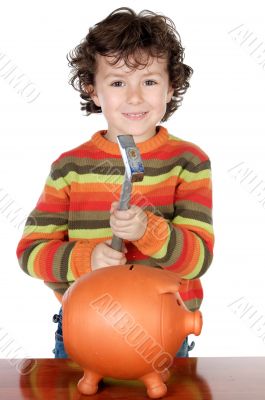 adorable boy breaking the money box