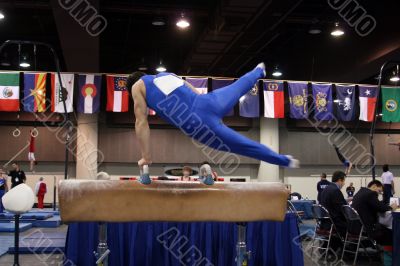 Boy competing on pommel