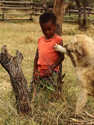 African child and dog
