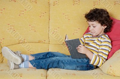 adorable boy reading