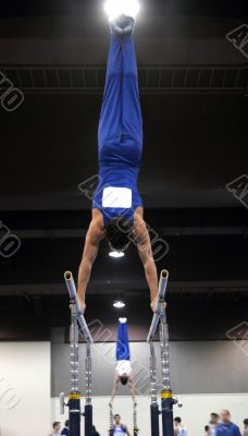 Gymnast on parallel bars