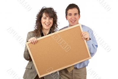 Holding the empty corkboard