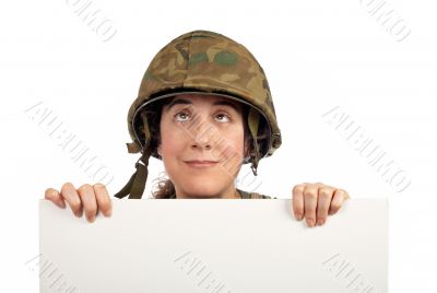 Curious soldier girl looking up