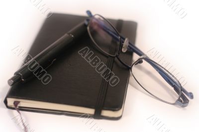 Pen, Diary and Glasses - shallow focus