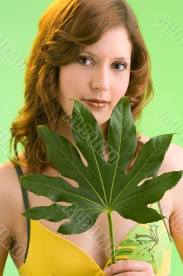 green leaf in her hands
