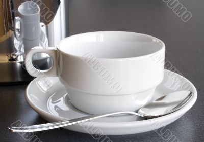 Empty Cup and Coffee Pot
