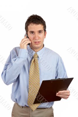 Serious businessman talking with cell phone
