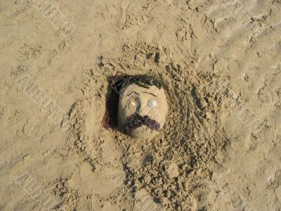Face in the sand