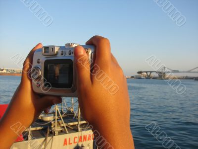 The camera in hands of the child