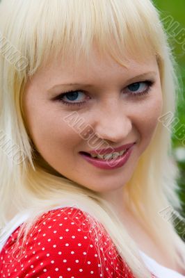 The young laughing girl on the nature