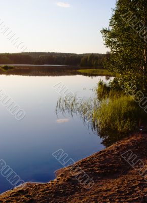 Evening on a beach of wood lake